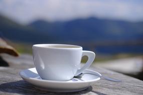 white Coffee cup on saucer close up