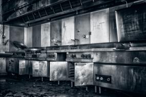 monochrome photo of an abandoned kitchen