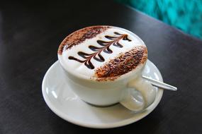 Cappuccino with a pattern on the foam in a cafe in New Zealand