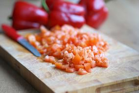 chopped omelettes and ripe red pepper on the table