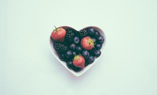 Berries in heart shape bowl