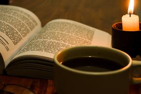 Book Reading and green cup