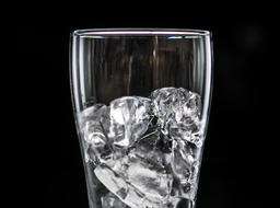 Beverage with ice cubes at Black Background