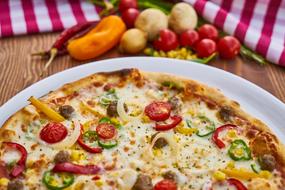 pizza with tomatoes, peppers and onions