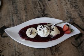 balls of ice cream with fruit puree