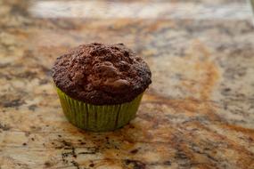 chocolate muffin on a marble table