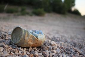 old tin can on the road