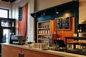 photo of coffee shop with american flag