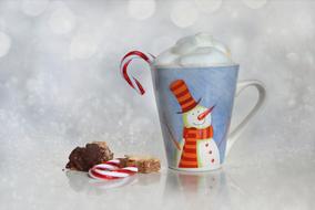 sweets and Christmas mug with hot chocolate and marshmallows