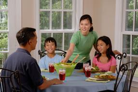 happy Asian family having lunch at the same table