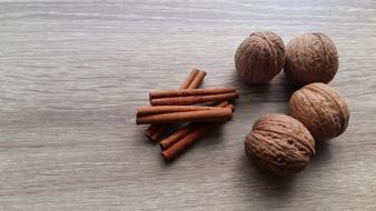 cinnamon sticks and walnuts on the table