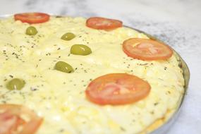 pizza with cheese, olives and tomatoes