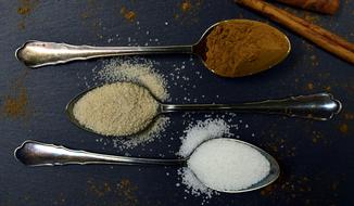 three kinds of sugar on teaspoons