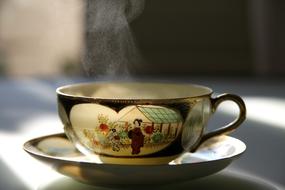 hot tea in beautiful porcelain cup