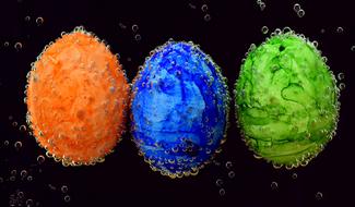three easter eggs in mineral water