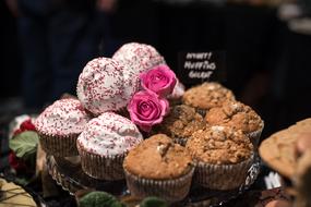 Muffins and flowers on tray