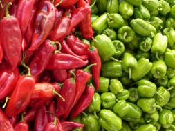 selling hot and green peppers in the supermarket