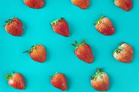 fresh strawberries on blue background