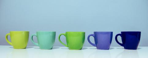 green and blue cups in row