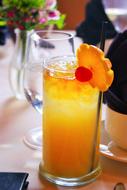 summer cocktail with orange and cherry