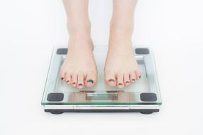 photo of the girl's feet on the scales