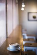 Coffee cup on table at cafe