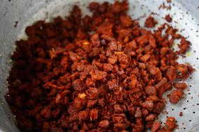 Close-up of the red and orange fried beef with curry