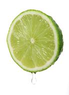 slice of lime with drop of juice