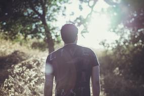 back view of man in dark t-shirt outdoor