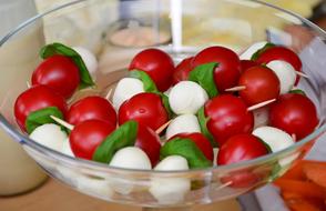 Tomatoes with Mozzarella on sticks in bowl