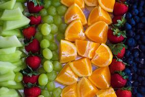 colorful cut fruits and berries