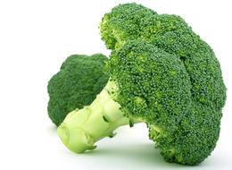 Beautiful, ripe, green broccolis at white background