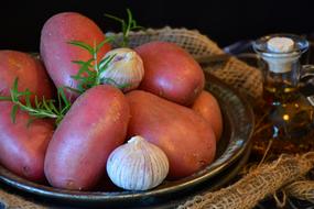 pink potatoes with garlic on a plate