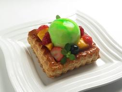 cake with natural fruits on a white plate