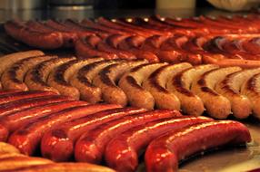 Beautiful and colorful Bratwurst sausages on grill