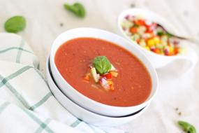 vegetables and tomato soup in blurred background