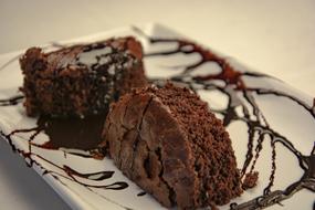 chocolate cake with topping on a white plate