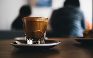 Coffee in glass on table in Cafe