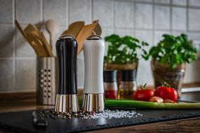 pepper grinder and salt grinder on the kitchen table