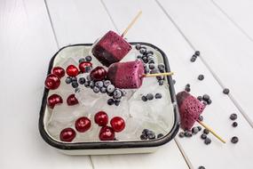 ice cream with berries in a plate