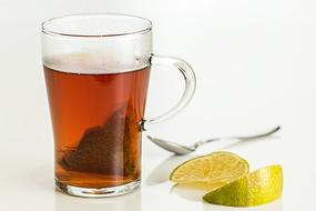 tea with lemon in a transparent bowl