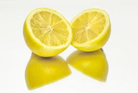 Beautiful, ripe, yellow lemons, with the reflections, at white background