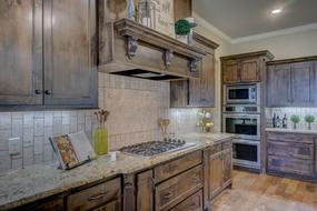 Beautiful interior of the kitchen, with the colorful, shiny, wooden furniture and lights