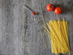 Cook pasta and tomatos