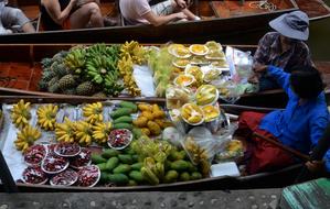 Close-up of the colorful and beautiful fruits for sale, on the boat store in Thailand