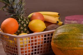 assorted fruits in a plastic basket