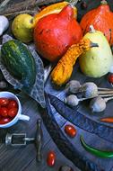 Beautiful and colorful still life with the pumpkins and other vegetables, in autumn