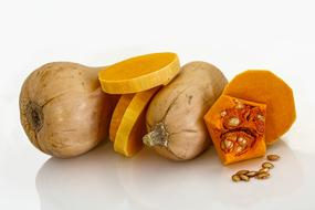 Orange and yellow Butternut Squashes at white background