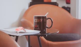 brown cup for coffee on the table in the living room