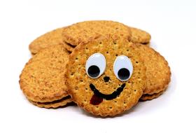 photo of a round cookie with a face